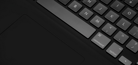 ColorWare Stealth MacBook Pro in matte black trackpad