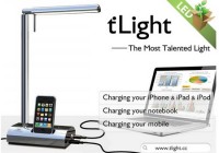 M&C tLight Desk Lamp docks iPod iPod, charges notebook and cellphone