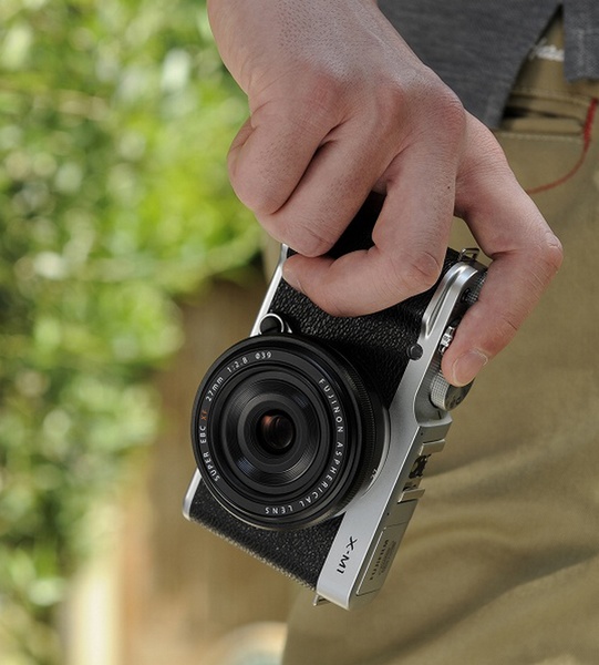 FujiFilm X-M1 Lightweight Mirrorless Camera on hand